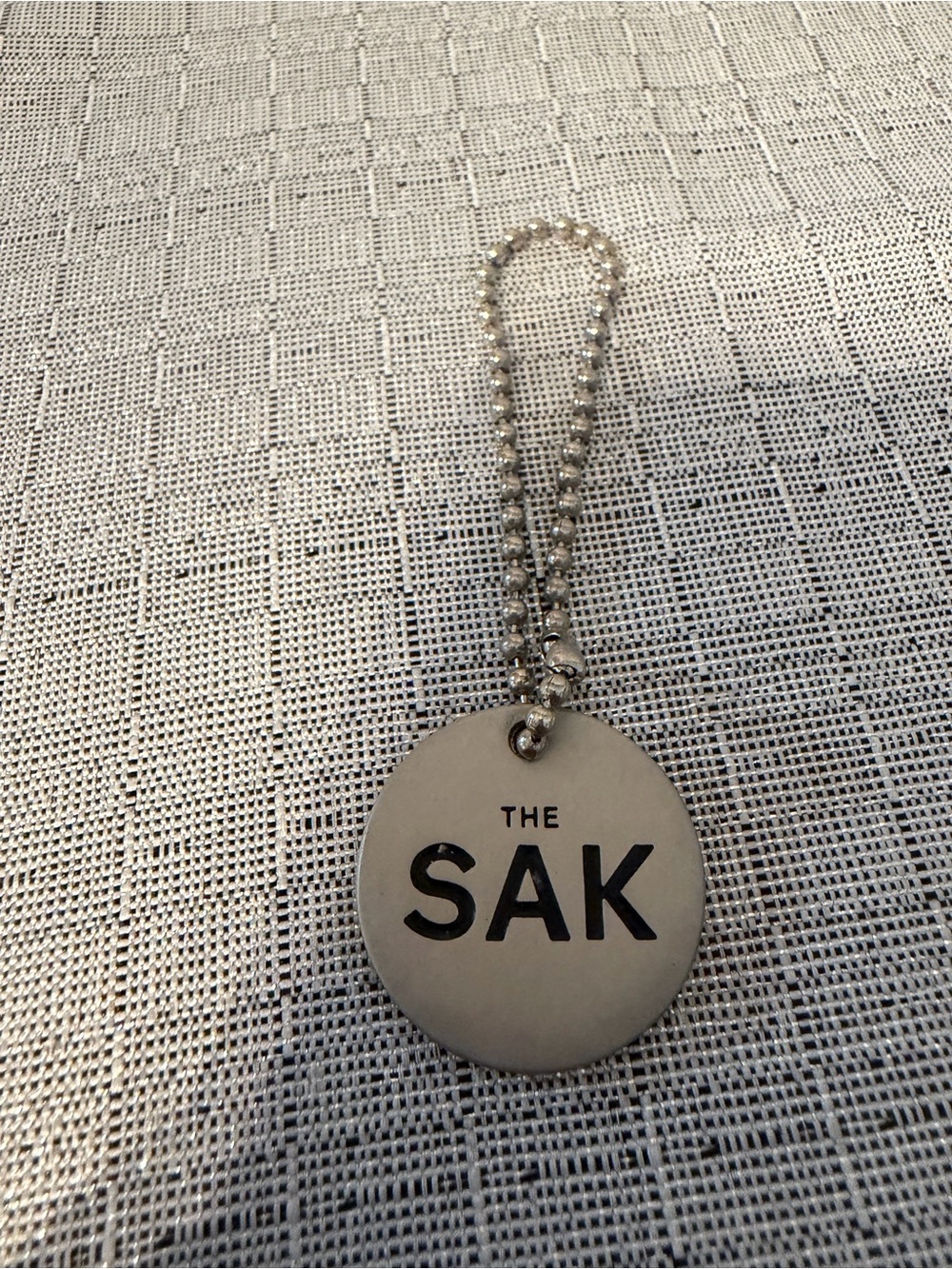 The Sak Silver Logo Charm Keychain - Picture 2 of 3